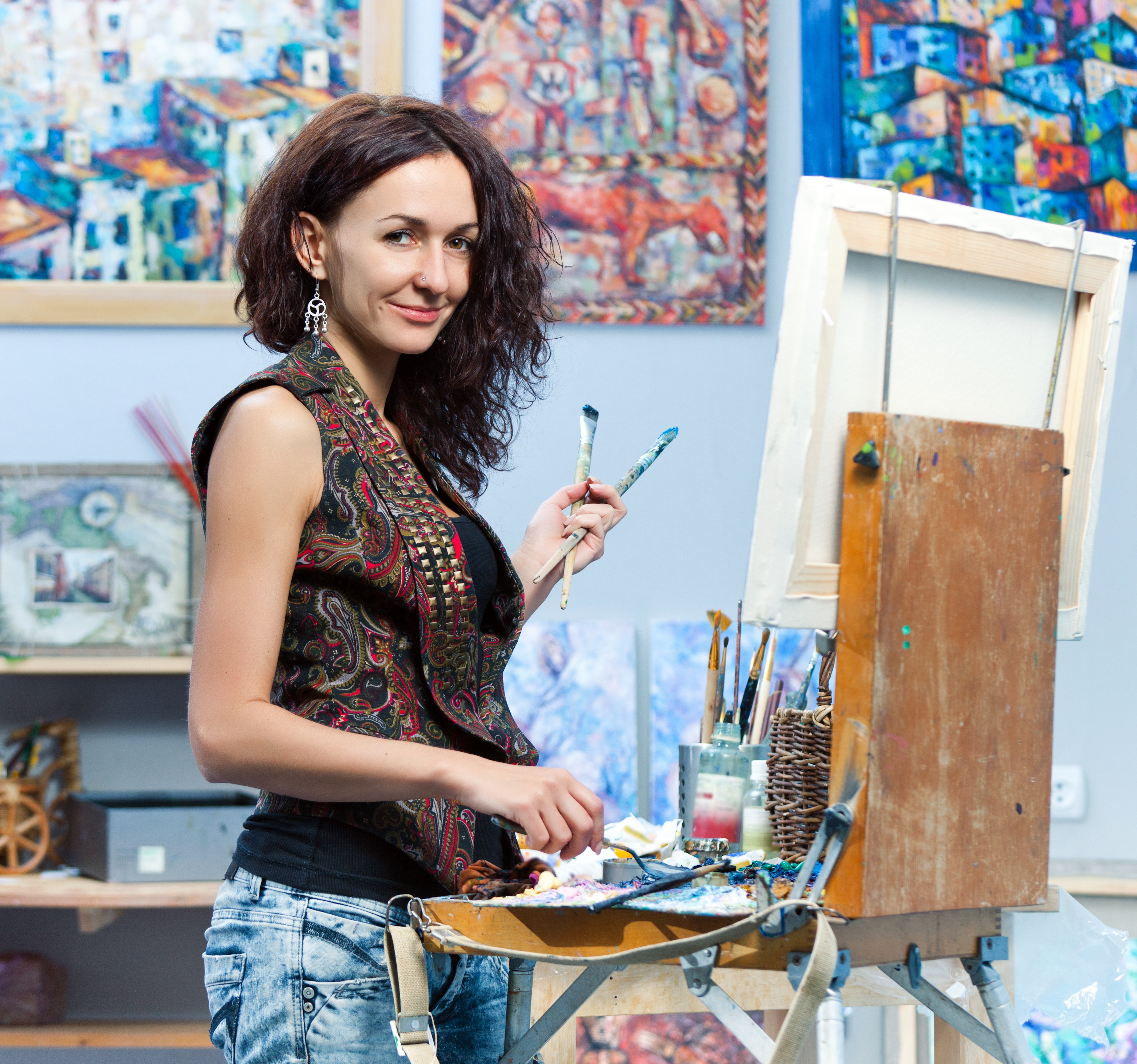 Artist painting in his studio